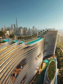 aerial view of aquarise building with pools and skyline