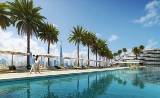luxurious outdoor pool with sun loungers and dubai skyline