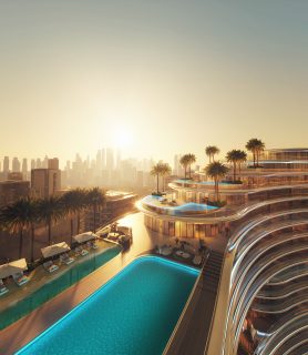 modern aquarise building with pools and city skyline