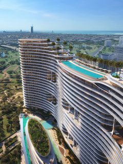 aerial view of aquarise waterfront tower with pool and skyline