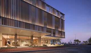exterior entrance of aria building with metal louvers