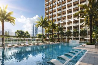 outdoor pool with lounge chairs and palm trees