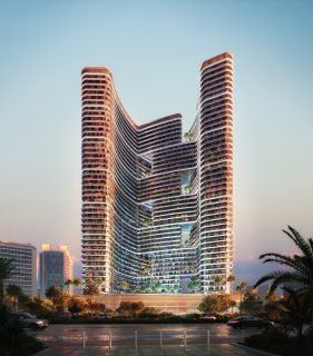 modern residential tower with curved balconies and greenery