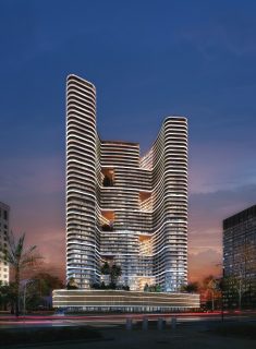 modern residential tower with curved balconies and greenery