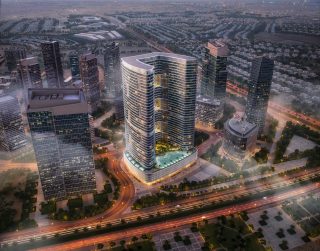 aerial view of modern high rise residential tower with city skyline