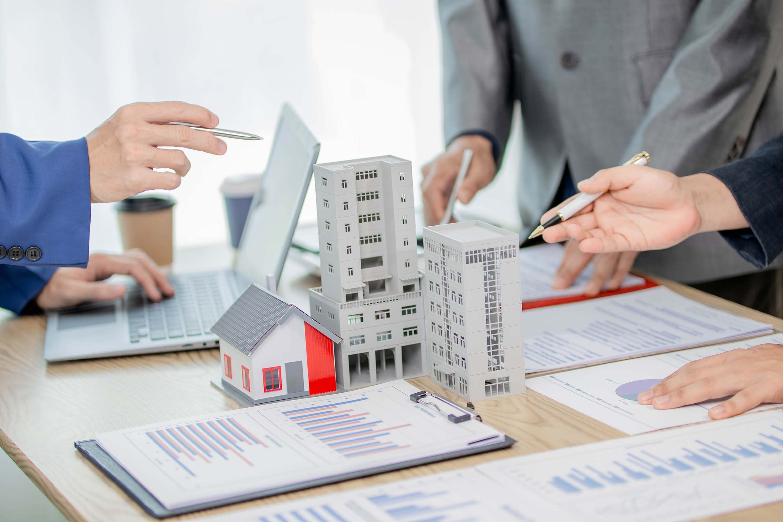 executives discussing dubai real estate market report