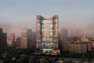 modern skyscraper with curved balconies at sunset