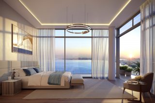 master bedroom with panoramic sea and city skyline views
