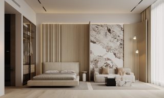 modern studio bedroom with beige bed and seating area
