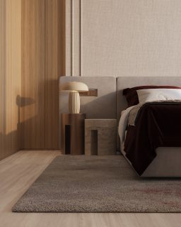 modern bedroom with burgundy blanket and warm lighting