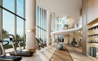 luxury gym with ocean and palm tree views