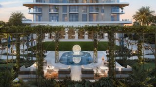 outdoor lawn seating with pergola and water feature
