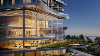 luxury building rooftop garden and indoor gym at dusk