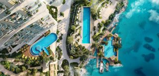 aerial view of sensia waterfront with pools marina and ocean