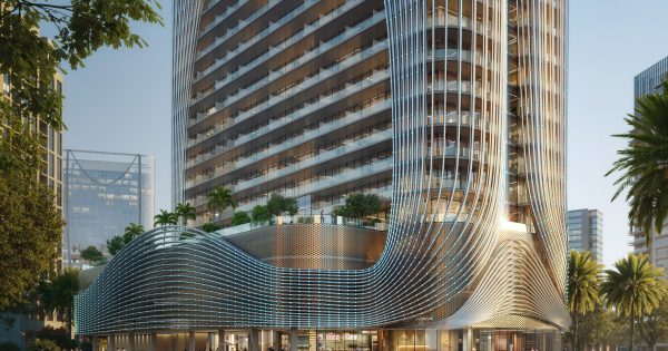 modern glass building with dubai skyline views