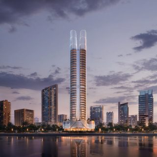 modern skyscraper with curvilinear design and palm trees