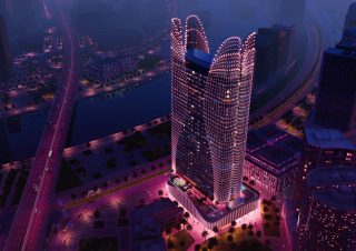 nighttime aerial view of skyhall tower in business bay
