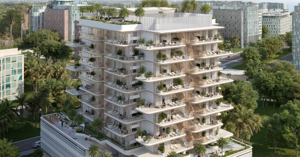 modern building with rounded balconies and greenery